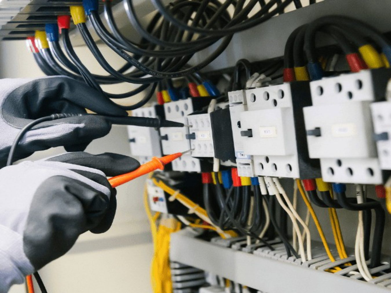 Chatham Generator Pros technician testing an automatic transfer switch during a standby generator install in Chatham-Kent, Ontario